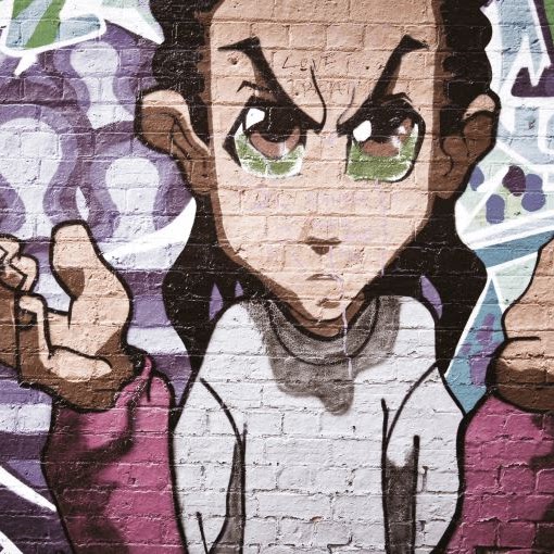 Urban graffiti image of a person spraypainted on a wall