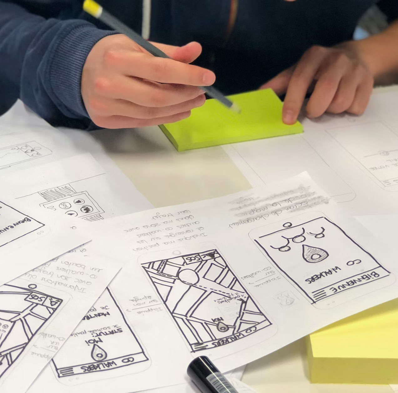 A person writing storyboards