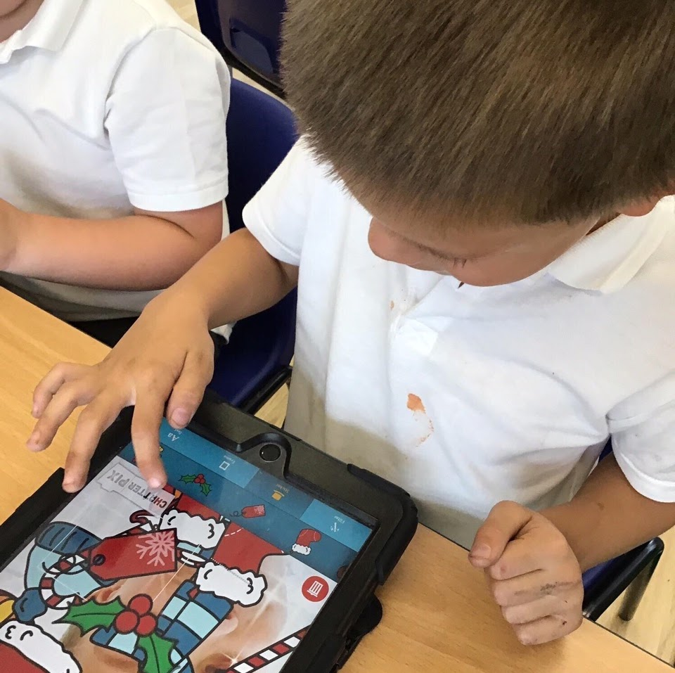 A child programming a robot on a tablet