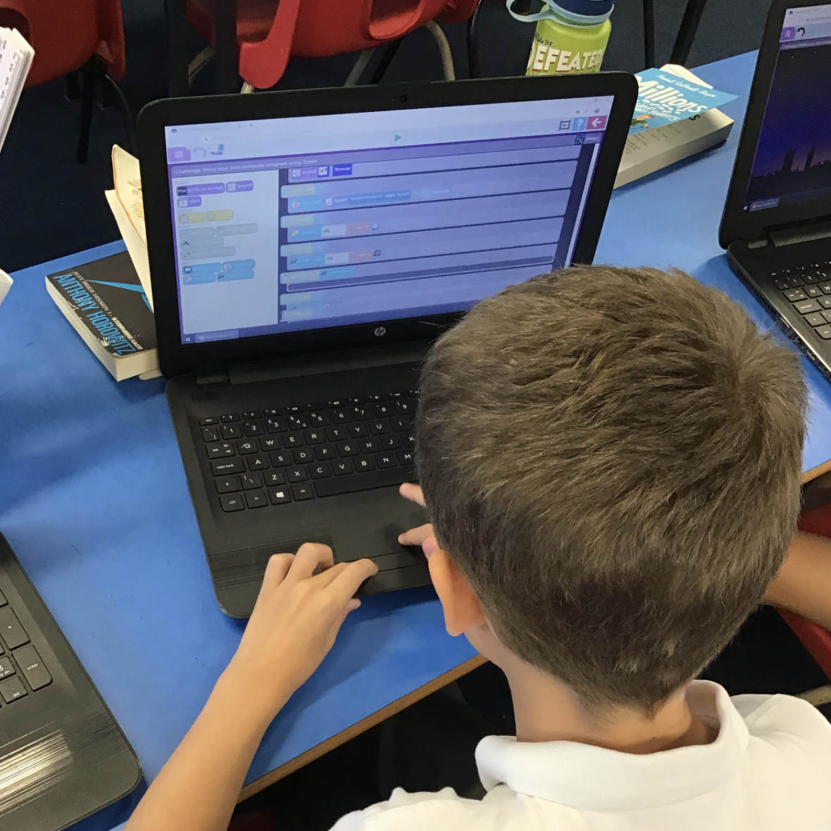 A child using software on a laptop