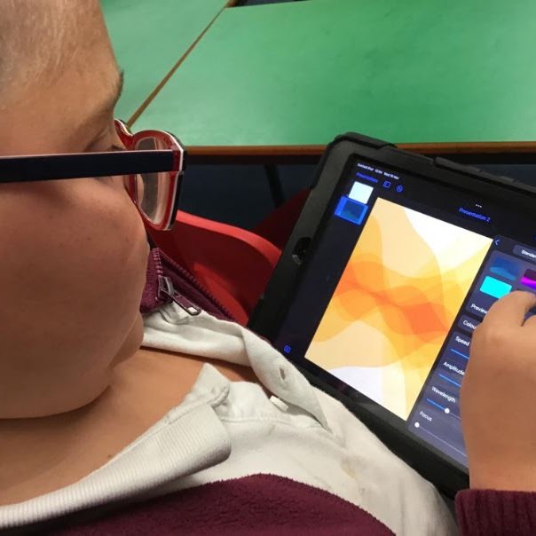 A boy using a tablet device