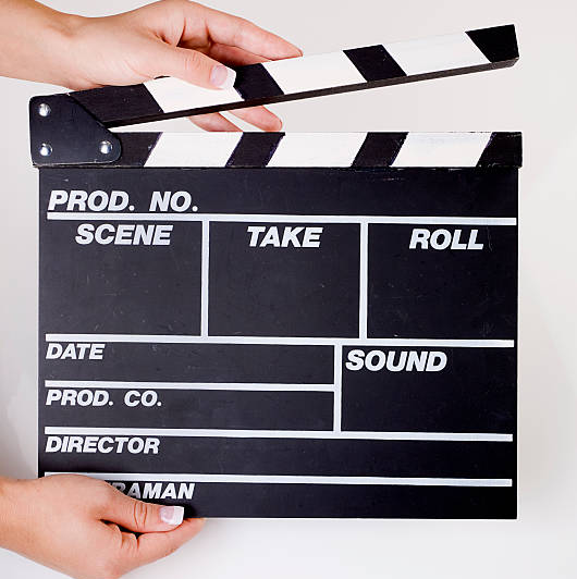 Hands with a clapperboard
