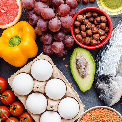A photo of eggs, fish, fruits and vegetables
