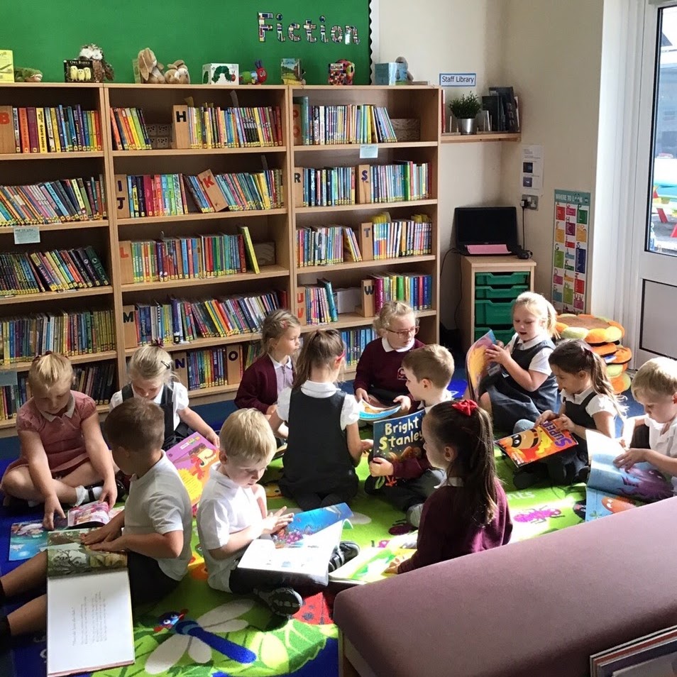 Children reading books in the library