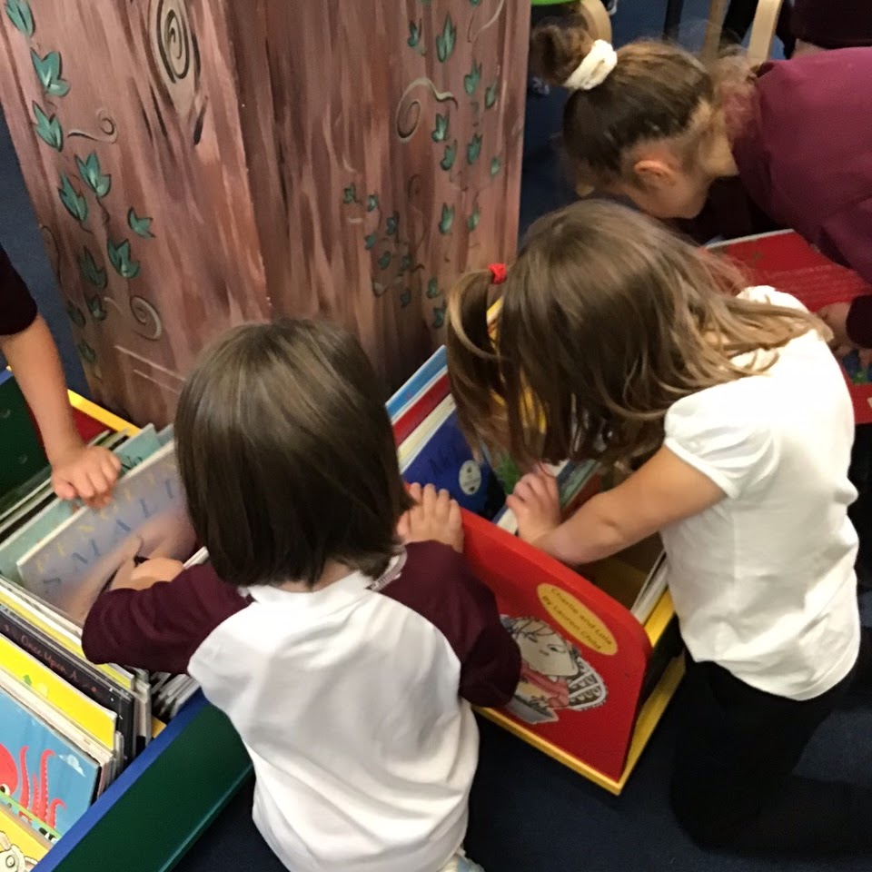 Children browsing for books in the library