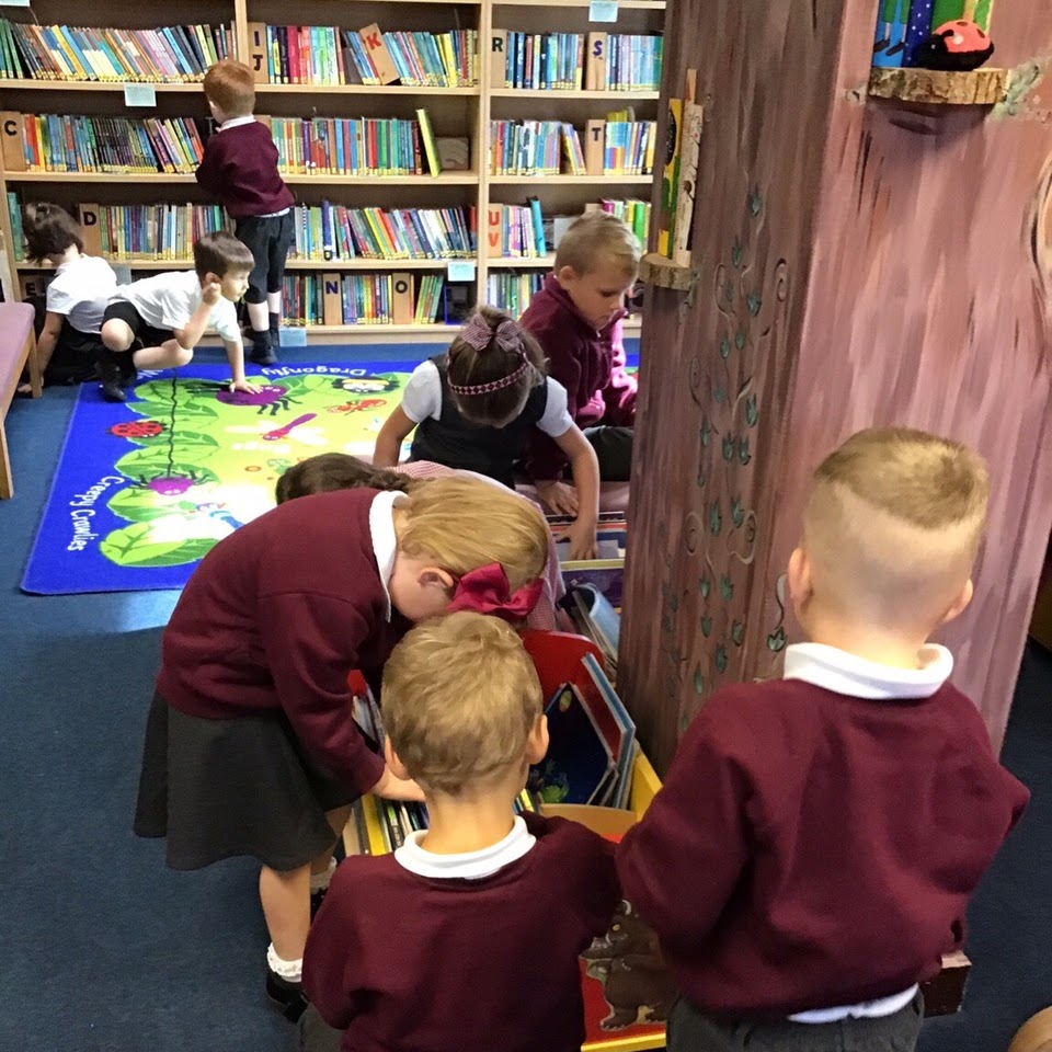 Children browsing for books in the library