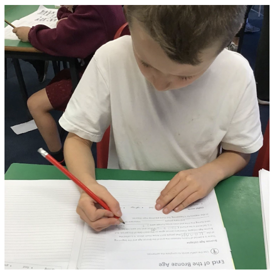 A child writing in a book